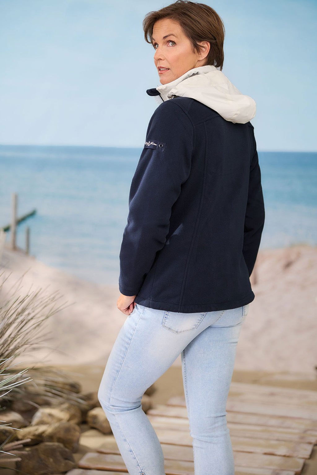 Nærbilde av glidelås på fleecejakke dame windbreaker fleece med avtakbar hette Dry Fashion