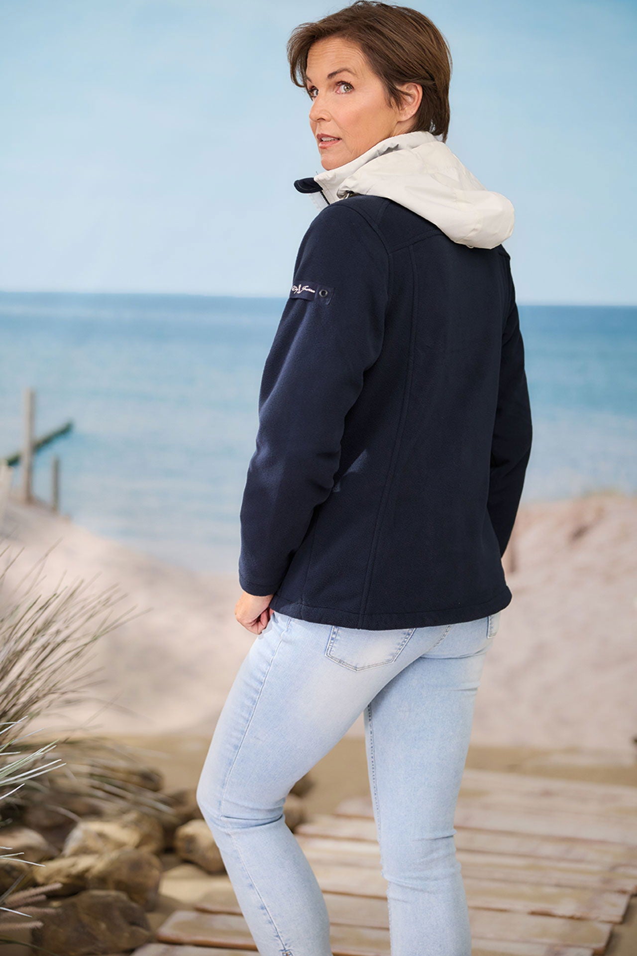 Nærbilde av glidelås på fleecejakke dame windbreaker fleece med avtakbar hette Dry Fashion