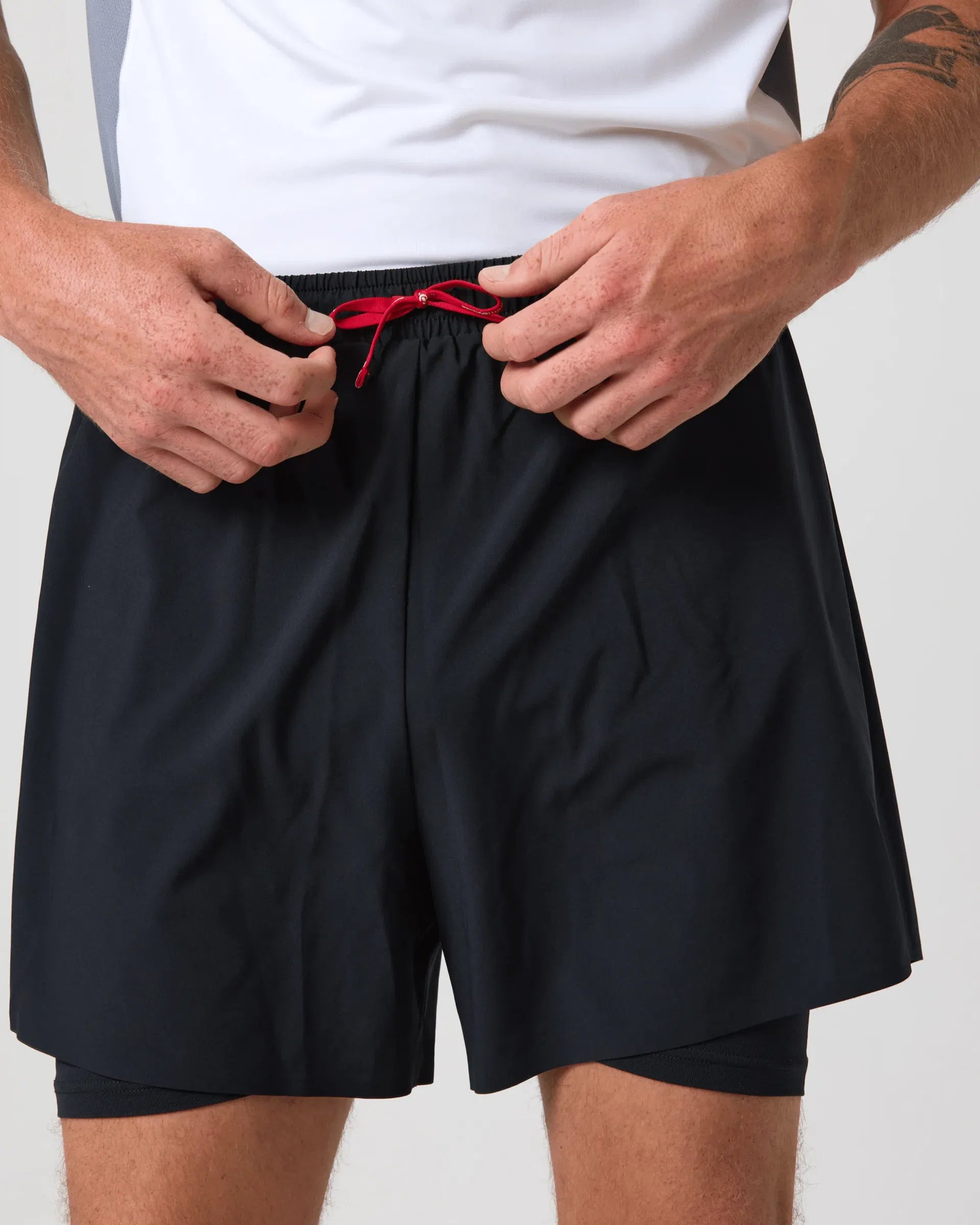 Zeroweight 2-i-1-shorts resirkulert polyamid med reflekterende detaljer